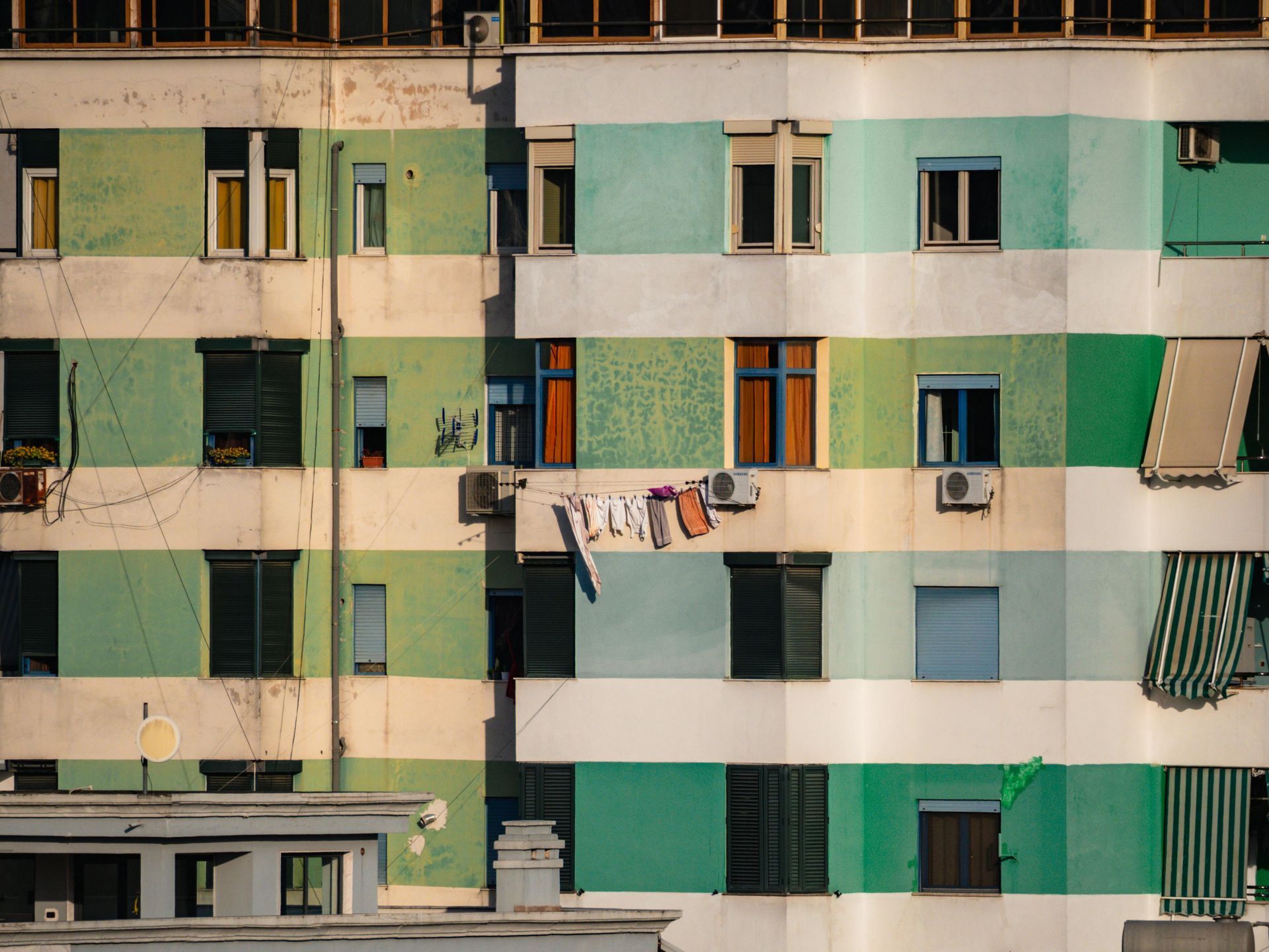 Roller shutters fitted to the windows of an apartment building